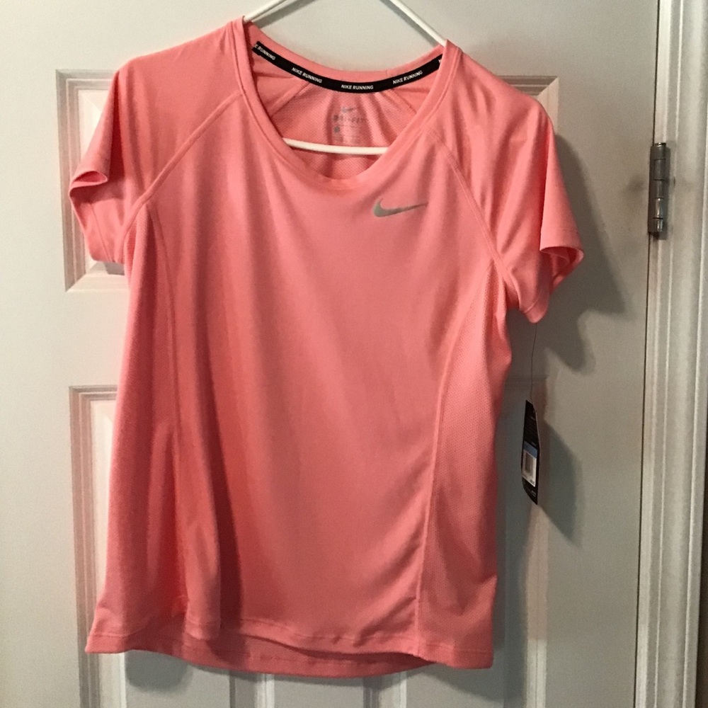 Peach colored Nike Shirt 🍑